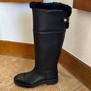 Brand new, never worn Stuart Weitzman shearling lined black boots!